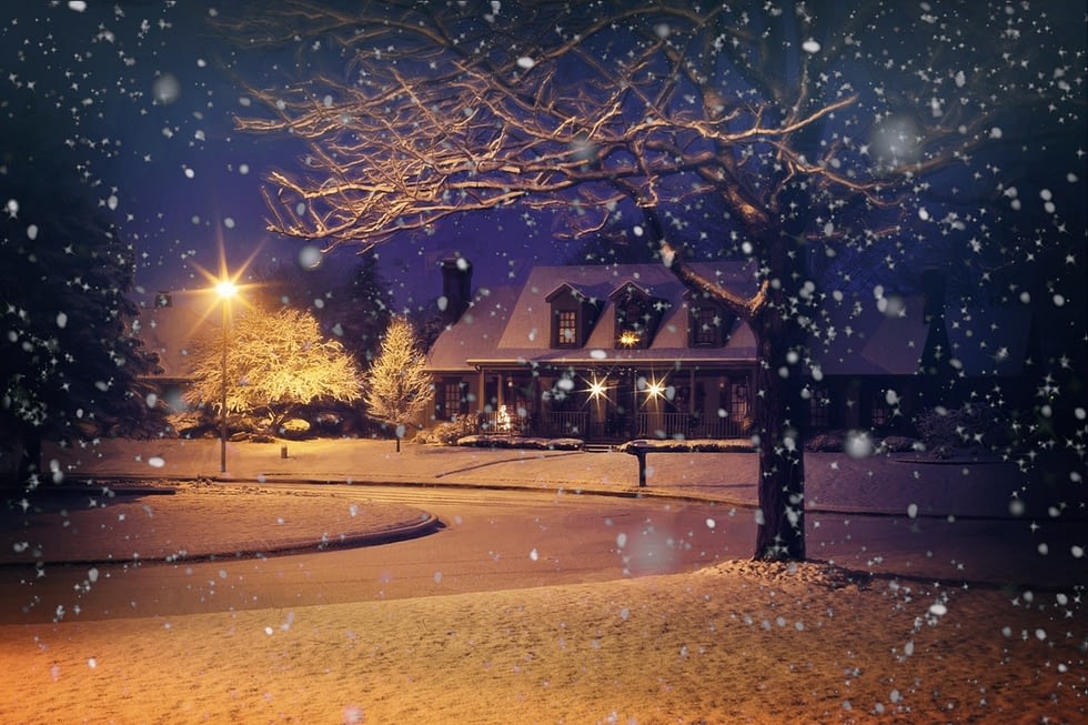 a house during the snowy evening